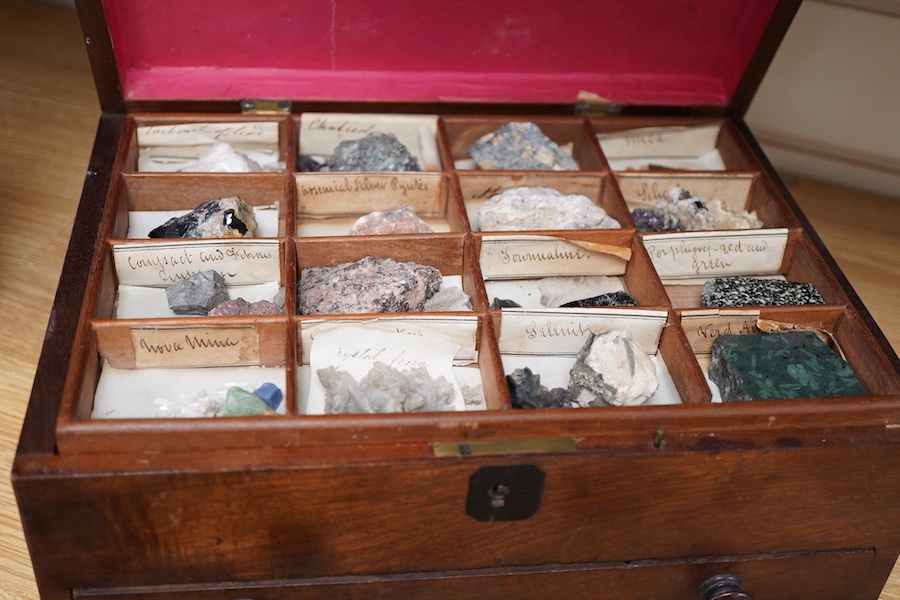 An early 19th century mahogany cased collection of mineral samples with old labels, comprising two removable trays and a drawer beneath, the case raised on bun feet, 30cm wide, 22cm deep, 14cm high